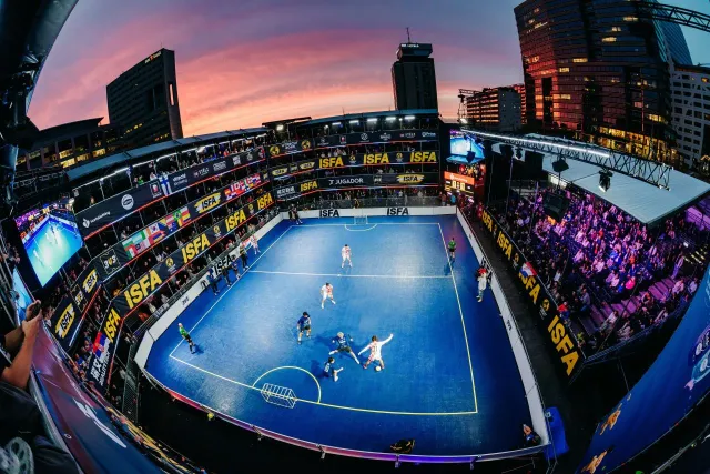 temporary stadium at night with street soccer action